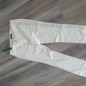Bebe white pants with bling on the sides